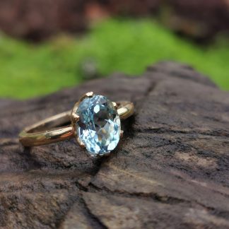 9ct Gold ring with Sky Blue Topaz set in Claws