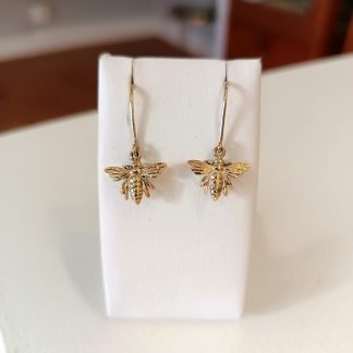9ct gold queen bee earrings with detailed wings and body.
