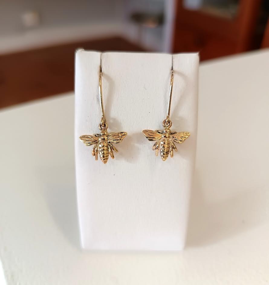 9ct gold queen bee earrings with detailed wings and body.