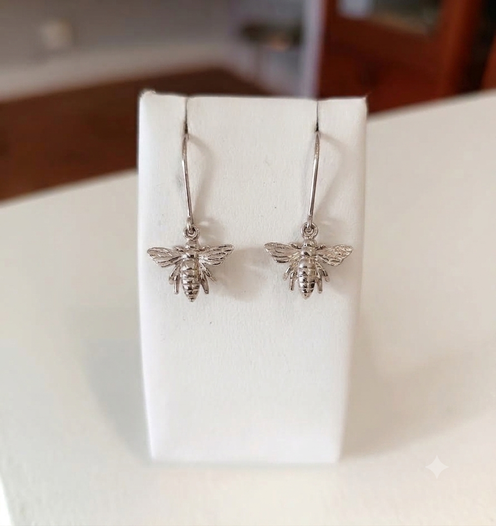 9ct gold queen bee earrings with detailed wings and body.
