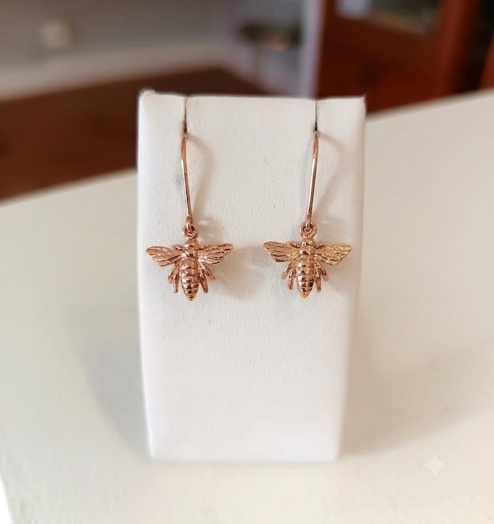 9ct gold queen bee earrings with detailed wings and body.